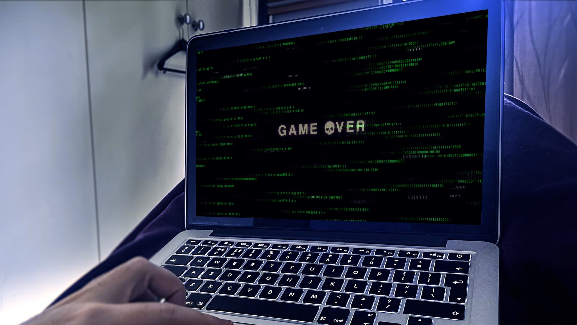Laptop with Game Over on screen