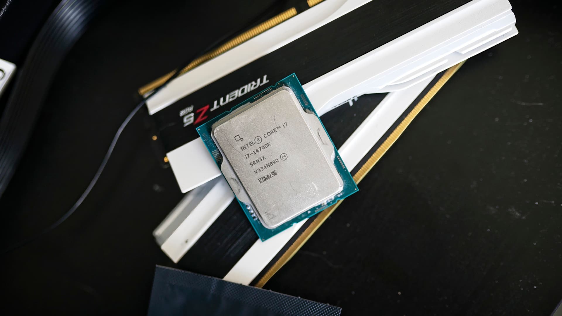 The Intel Core i7-14700K sitting on RAM sticks.
