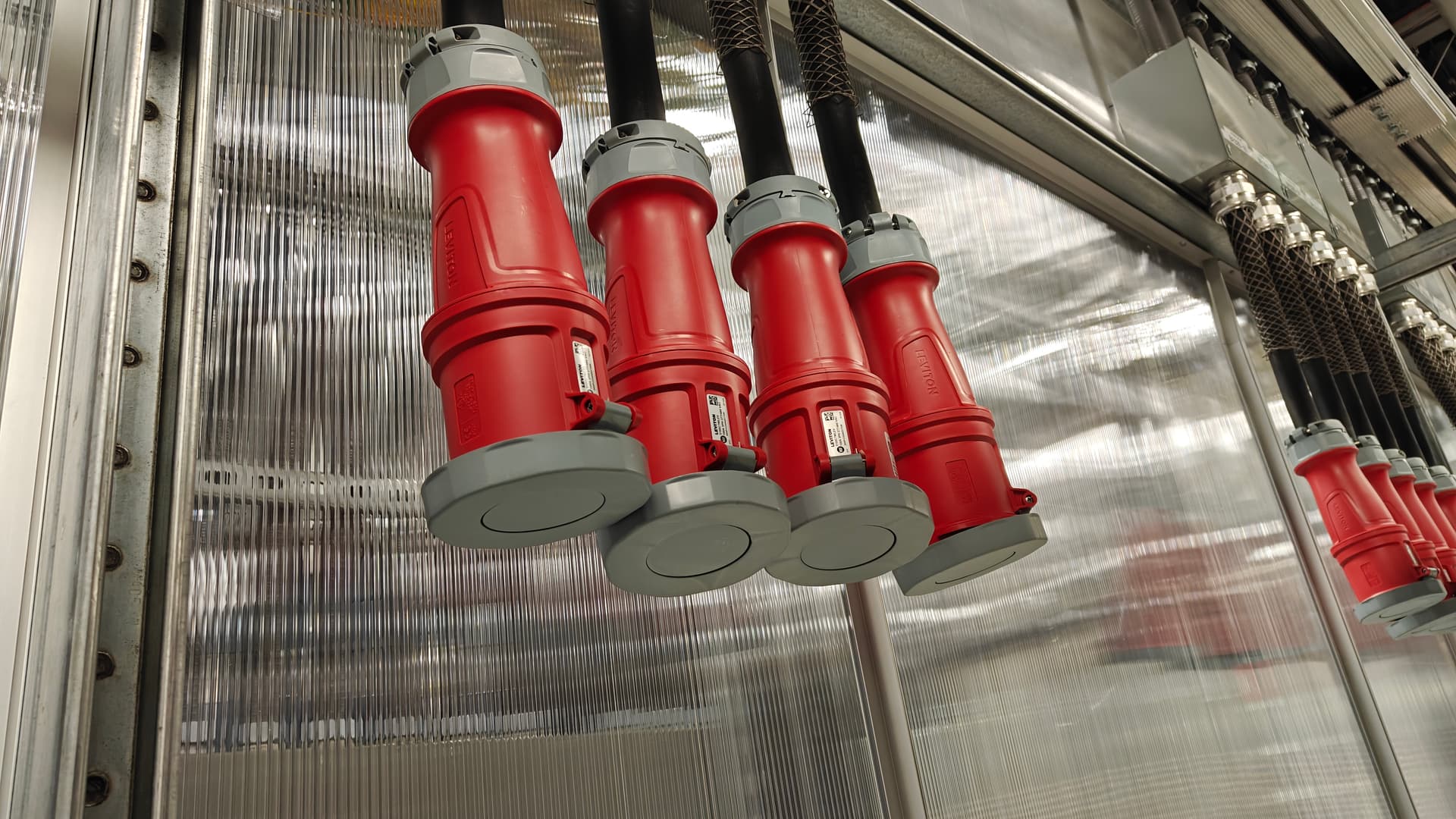 NVL72 800VDC power plugs hanging in the SuperLab room