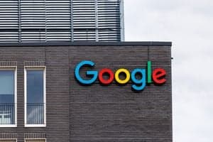 Google Alphabet logo signage outside corporate headquarters as AI researchers depart for OpenAI and Anthropic